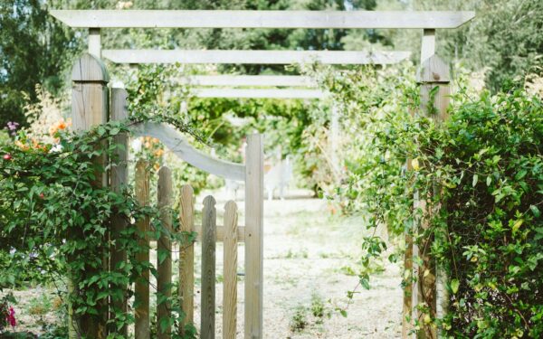 Creating character with gates and arches at the entrance to your plot