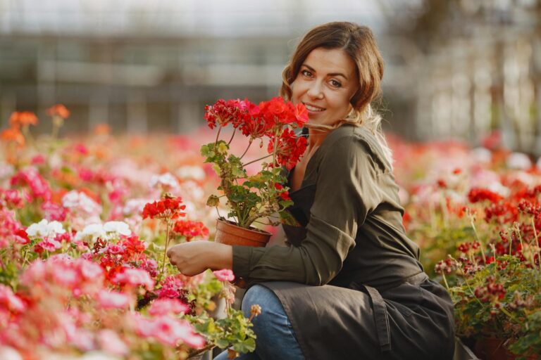 Gardener cleaning perennial flower bed
