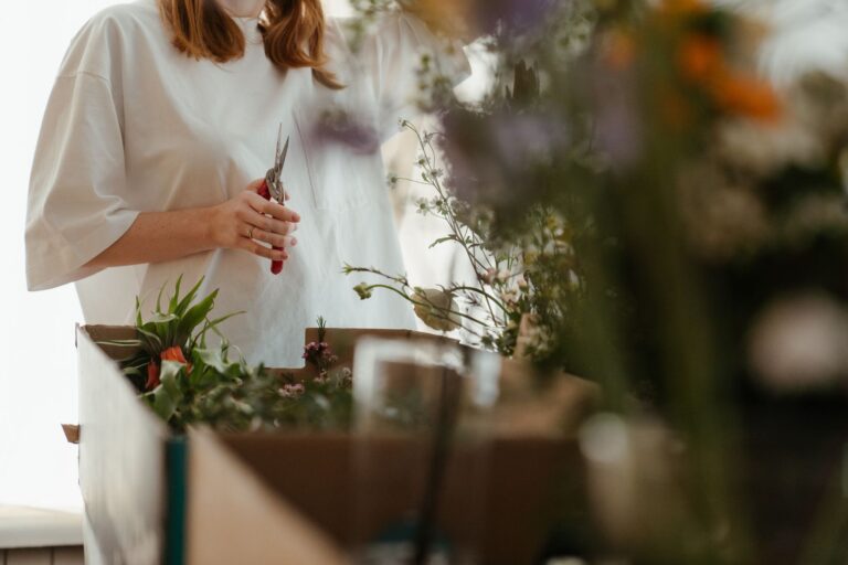 Hand deadheading flowers